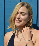 Loveboat Baumwoll Armband schwarz mit Schiffchen aus Silber