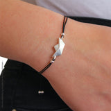 Loveboat Baumwoll Armband schwarz mit Schiffchen aus Silber