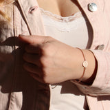 Bessere Zeiten Armband mit Schrift Münze aus Silber rotgoldplattiert und Federring